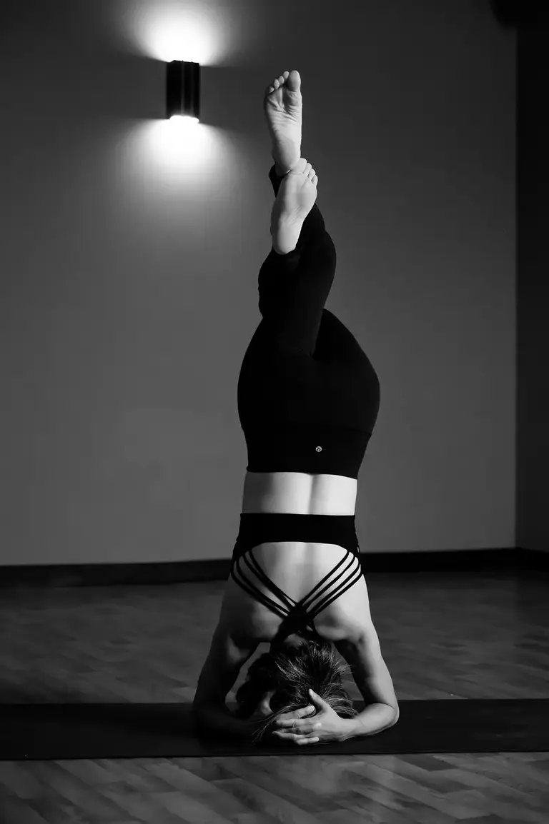 Yoga student practicing headstand at Harmony Yoga and Fitness